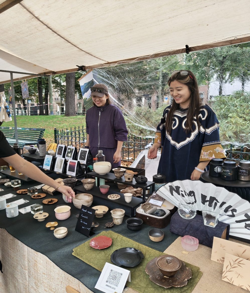 Yueqi Wang of Ning Hills Tea at her stall with ceramics and tea